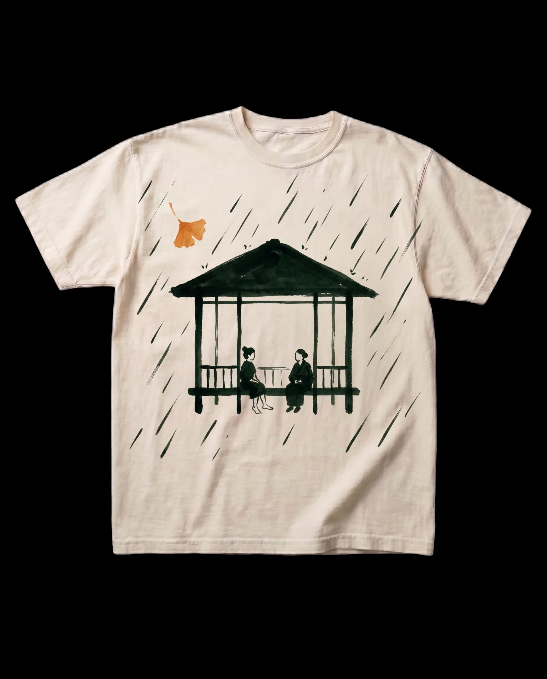 The Gazebo tee in Bone, laid flat: a sumi-e ink print of a garden pavilion in rain, two small seated figures, and one orange ginkgo leaf.
